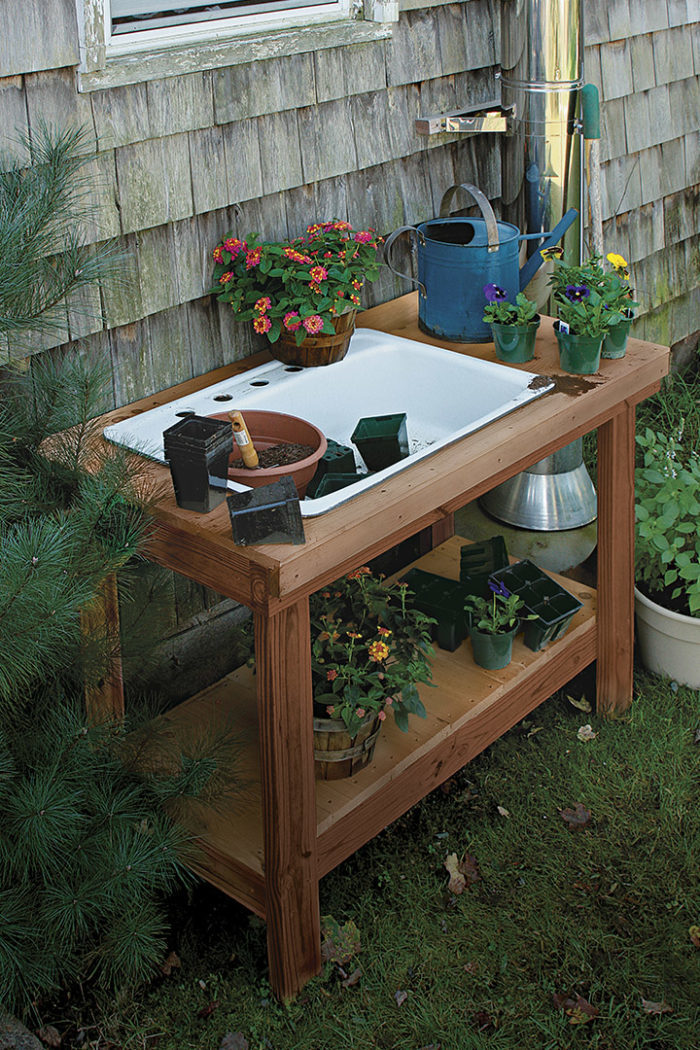 finished potting bench with sink, plants and watering can