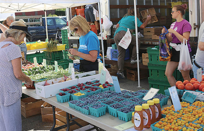 People shopping at a Farmers' Market