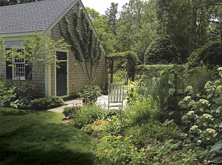 this patio takes advantage of unused space to help a small garden feel larger