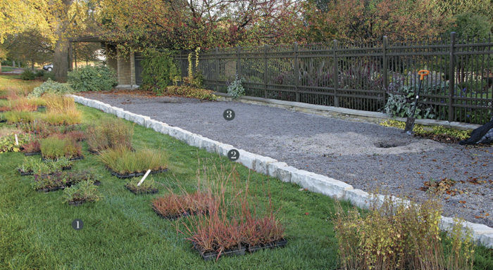 beginning of a gravel garden with edge put in and gravel spread