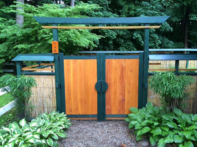 closed gate that leads into an area of the garden