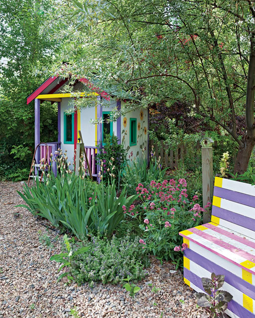 The slightly zany paint job on the garden house and bench