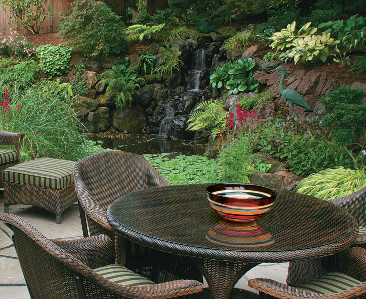 For large spaces, a water feature and plenty of plants can make a great backdrop.