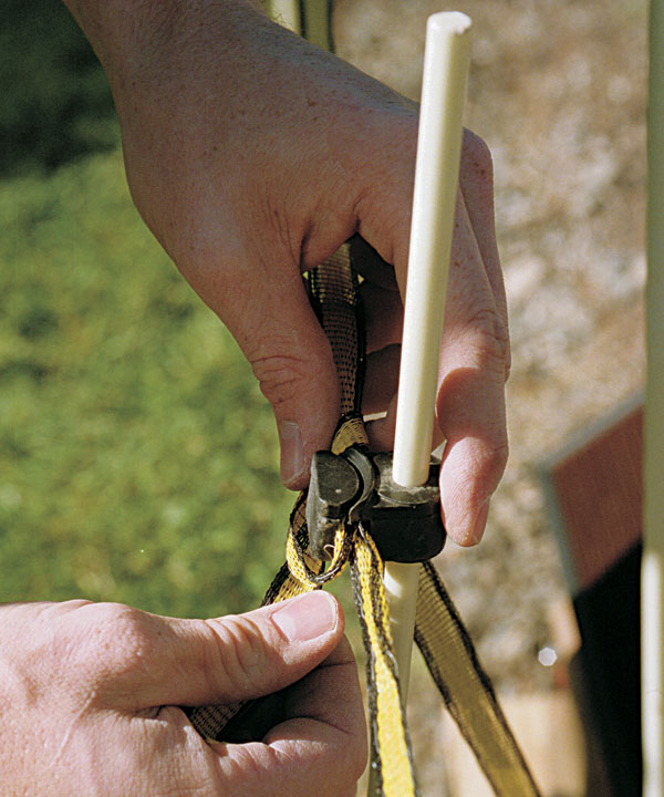 Position a plastic insulator on each rod 30 inches above the ground