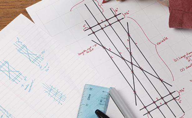 layout of design drawing with ruler and pens