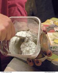 hand mixing the mortar in a small container