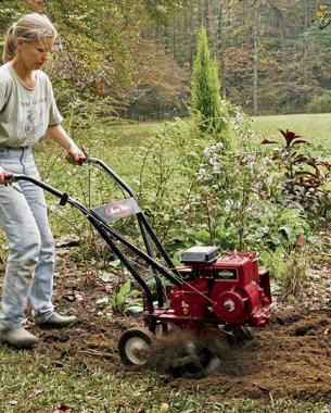 woman tilling the soil