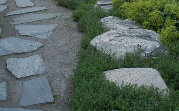 Boulders as edging next to a stone pathway