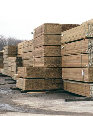 Piles of lumber outside in a lumberyard