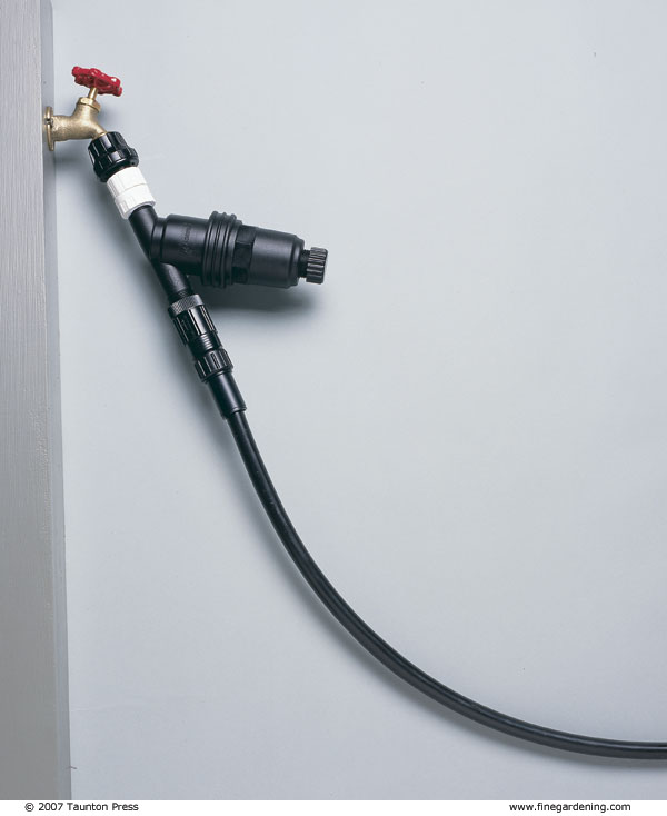 Attach a drip-irrigation system to a hose bib