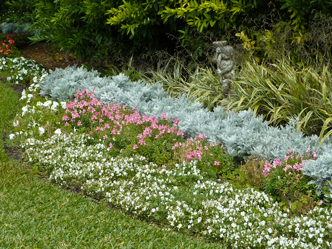 Perennial border with cherub