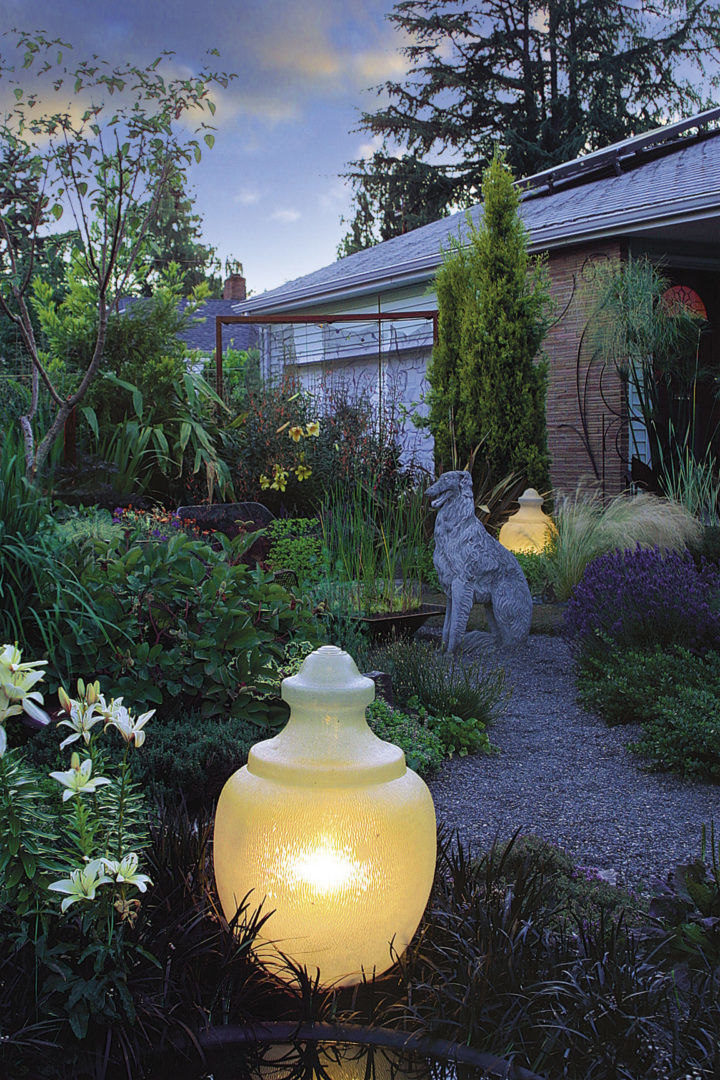 A repurposed streetlight creates a soft light in the garden