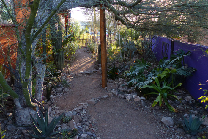 Using rocks to create a tiered series of basins controls and stores rainwater runoff.