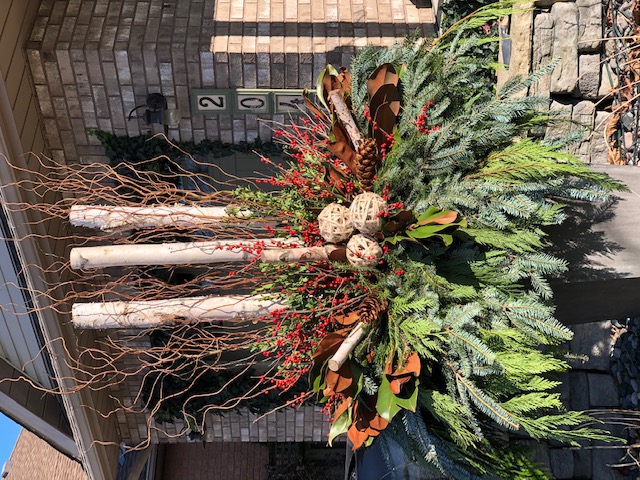 winter arrangement with berries and branches