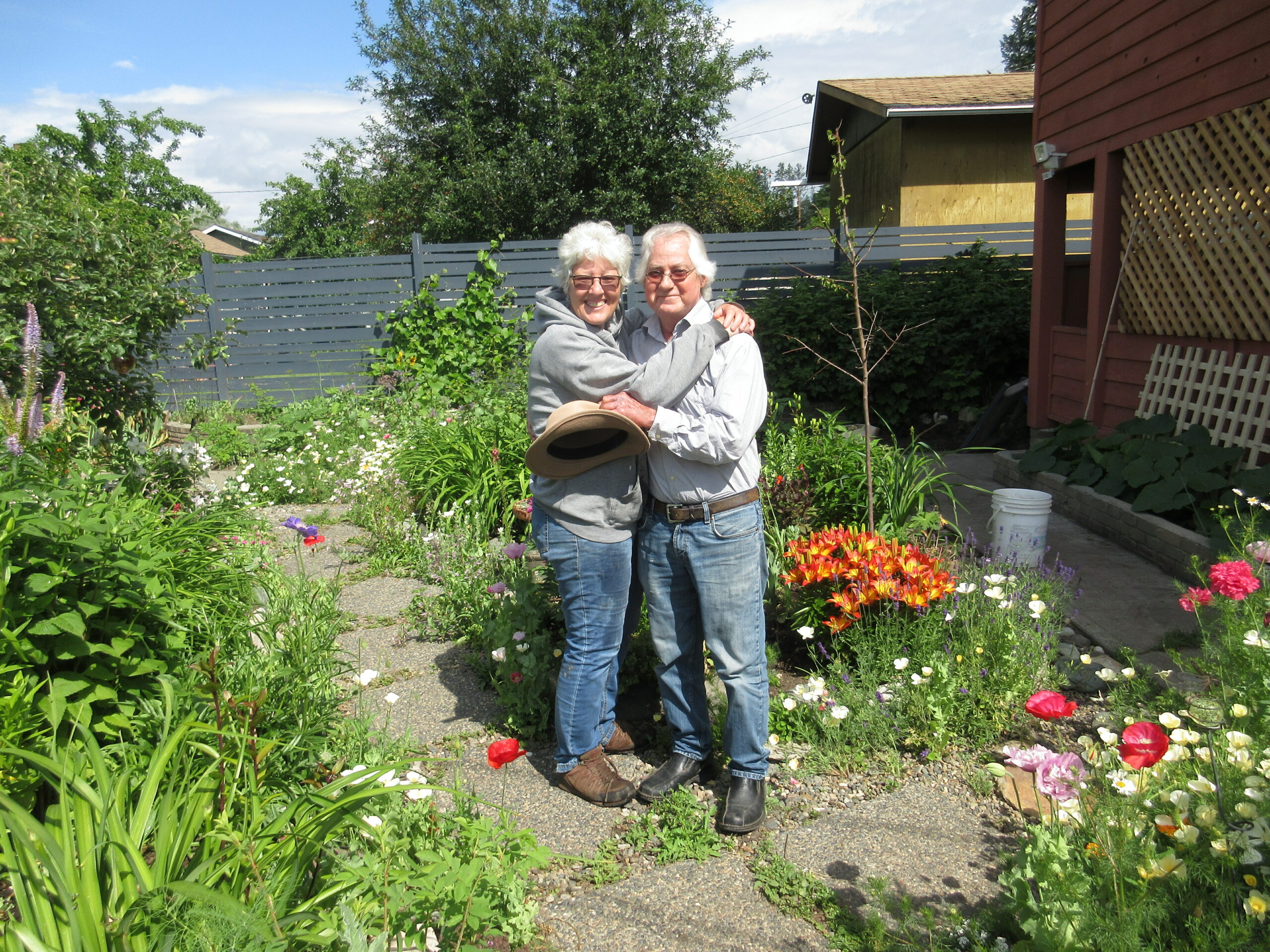 gardeners posing in her garden