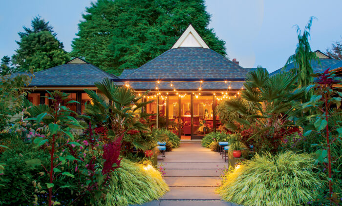 House at twilight with garden in front