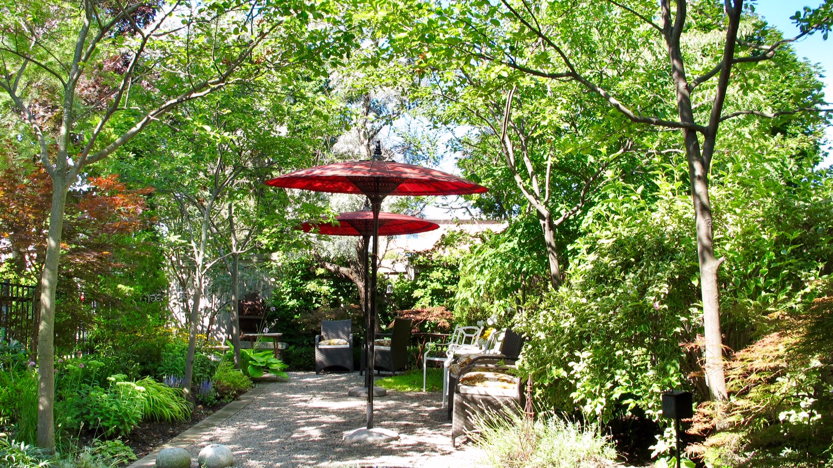 garden seating area surrounded by greenery