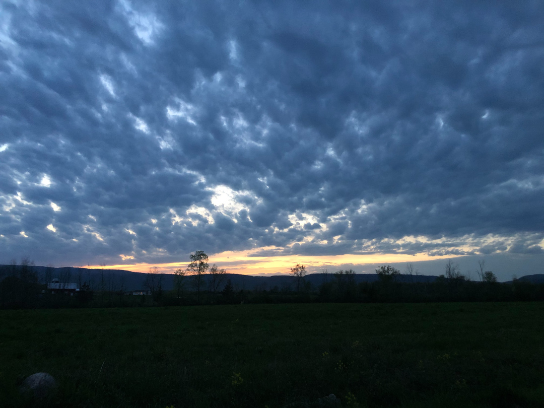 skyline at sunset with lots of clouds