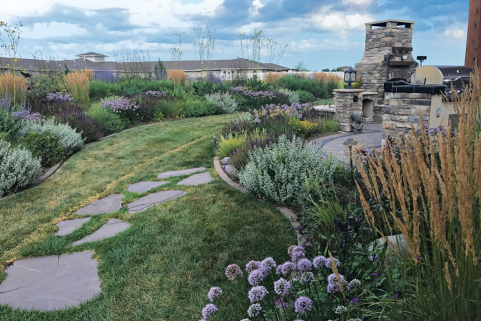 Need a screen but not a boxy hedge? Layering plants with different heights and seasons of interest creates a bermlike island bed that provides year-round movement, color, and texture—along with treasured privacy.