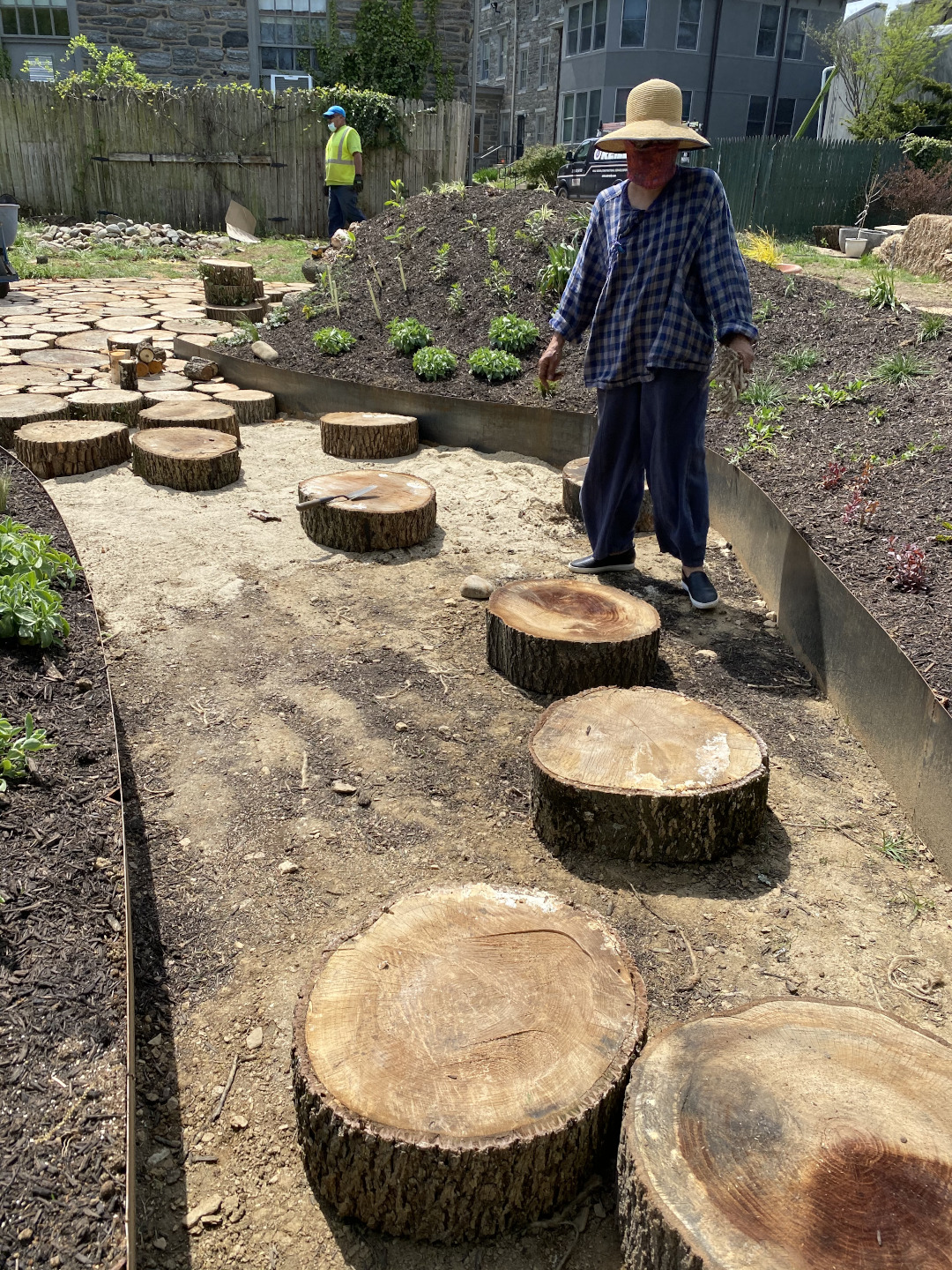 Sliced sections of logs being placed to form a path