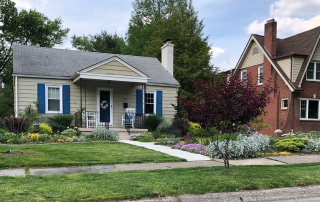 front yard garden in front of small home