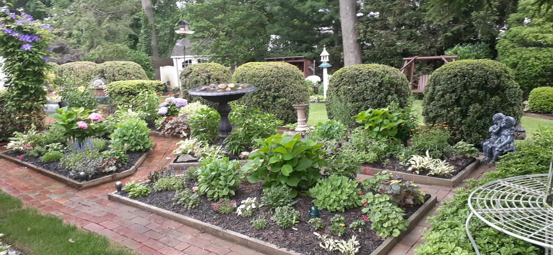 Brick paths around a many square garden spaces