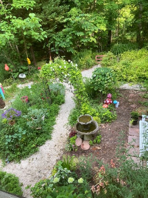 view of garden from above, with arbor and bird bath