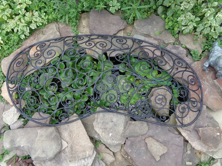 small garden pond with iron cover