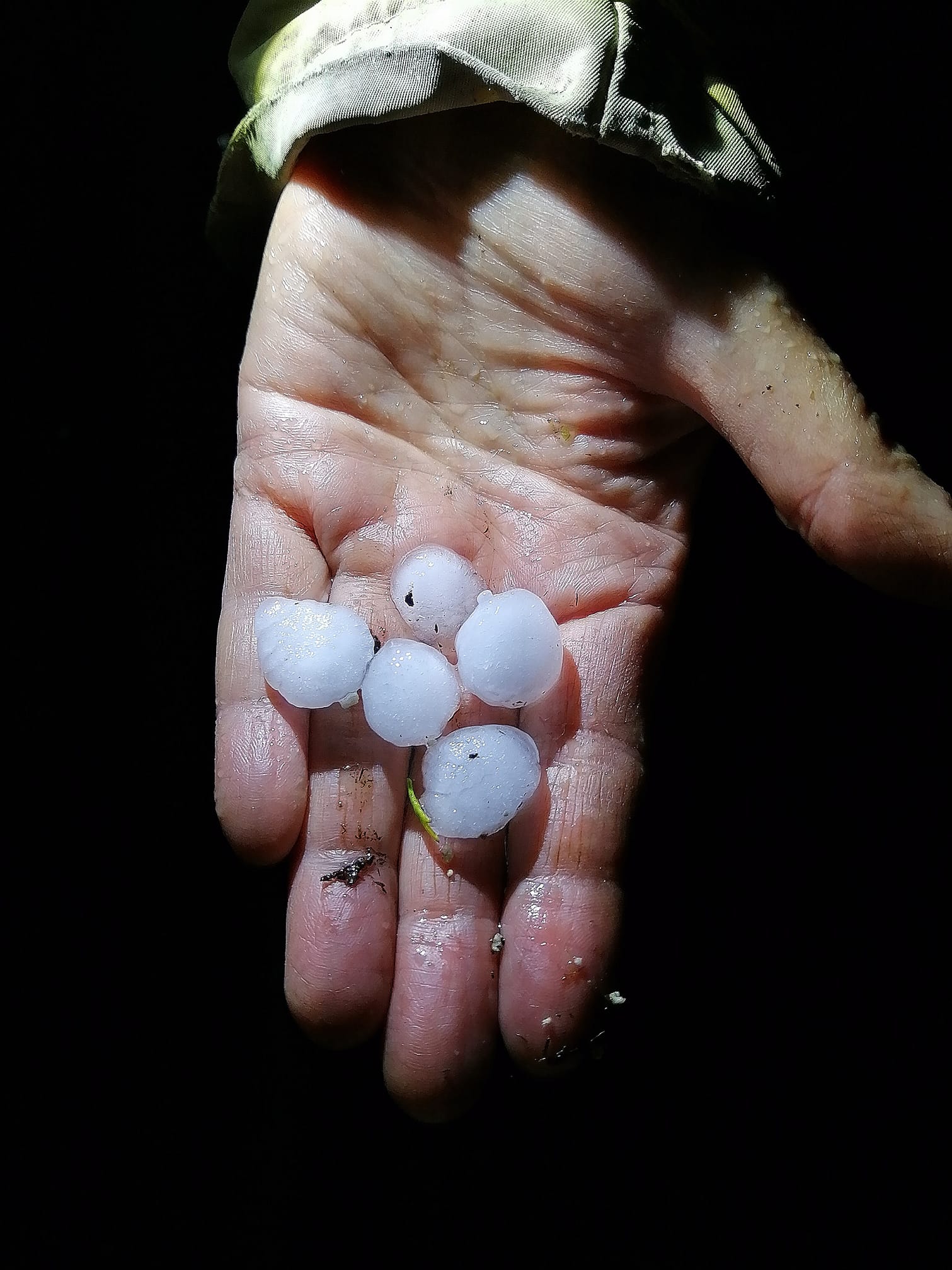 hail the size of quarters in a hand