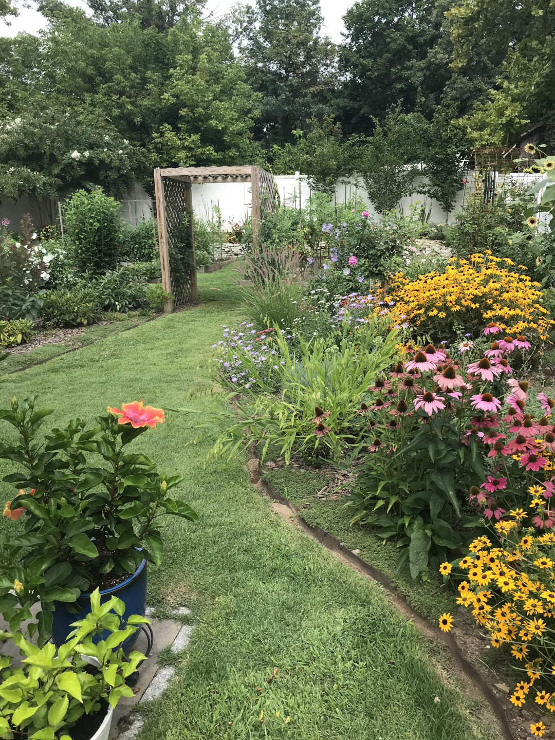 View down through the garden with neatly edged grass paths