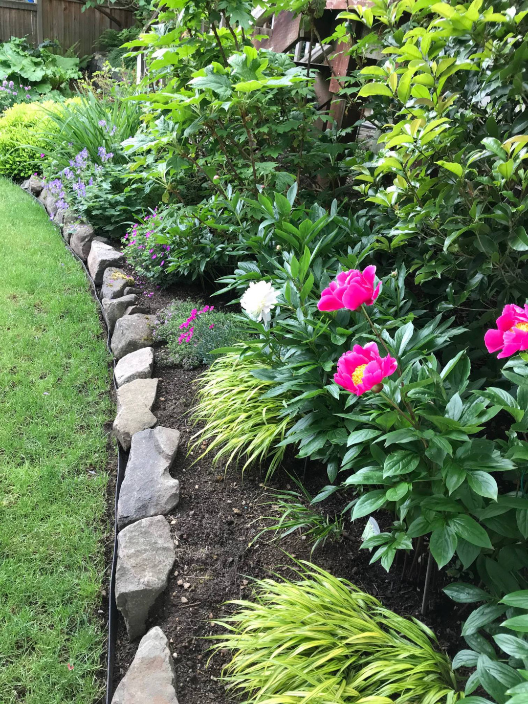 stones mixed in with the garden bed