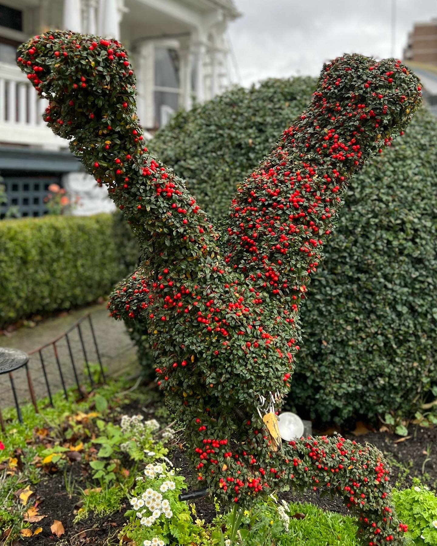 topiary eagle, with a topiary fish in its beak