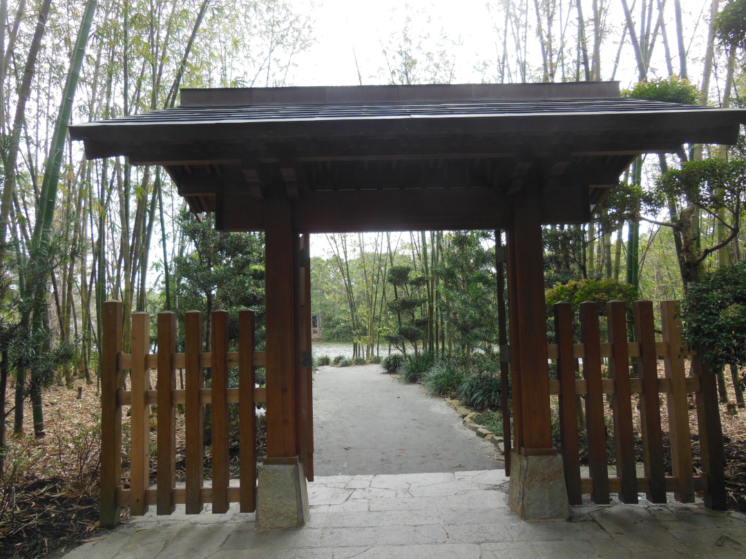 garden gate framing a garden path