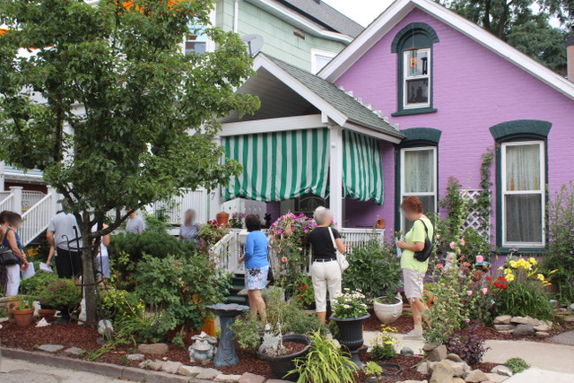 bright pink house with a small front garden