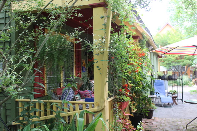 covered porch of a colorful house