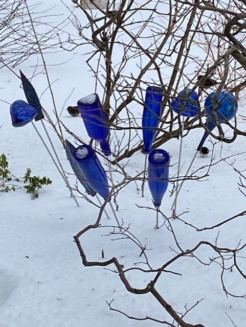 garden decor made of blue glass bottles