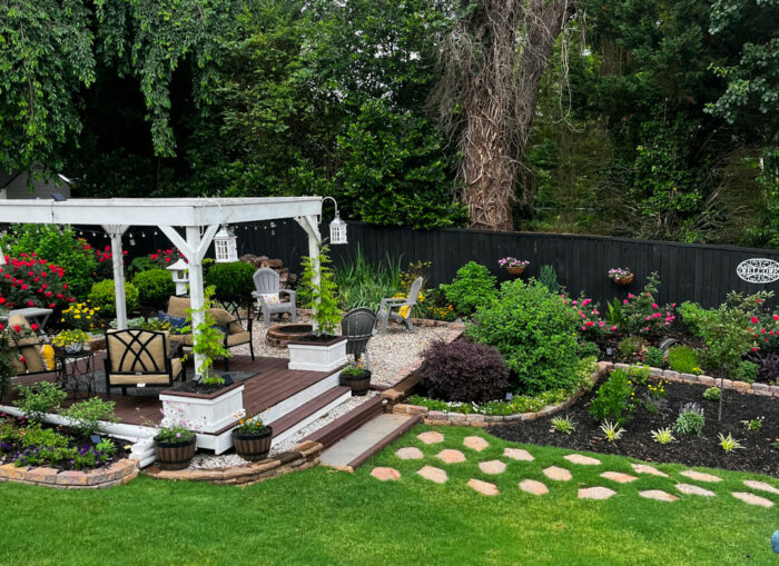 wider view of garden transformation and surrounding garden beds