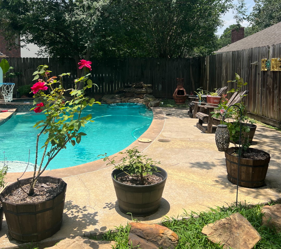 barrel container plantings around an in-ground pool