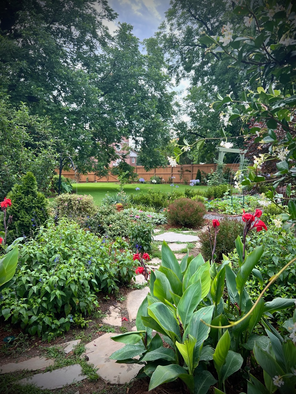 finished garden with hardscaping and plants in bloom