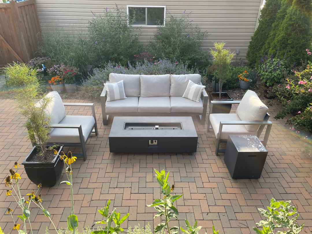 outdoor couch and chairs on a garden patio