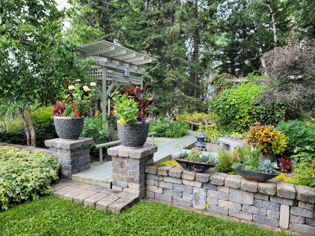 wide view of Japanese-style garden with pagoda and container plantings