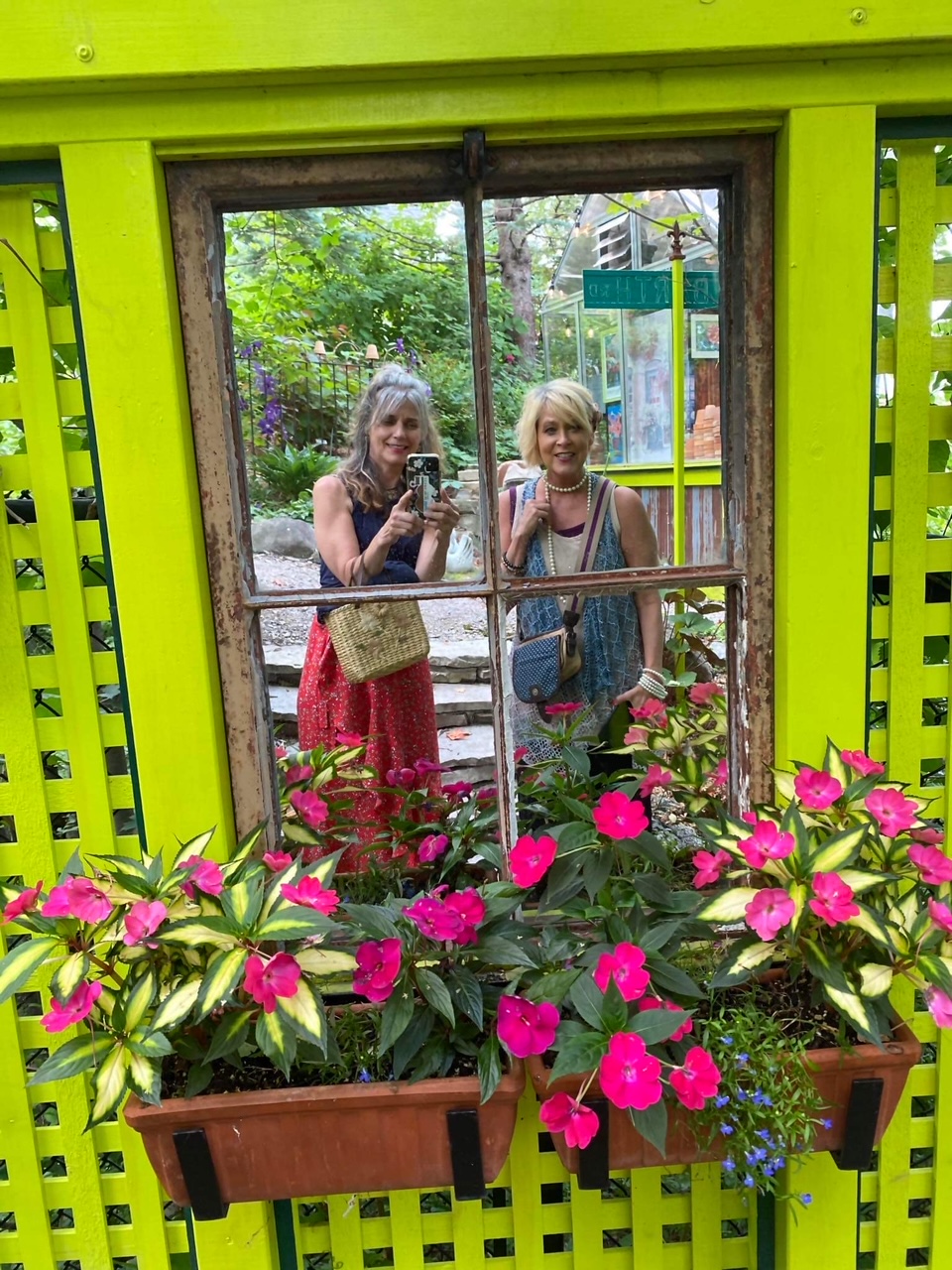 garden visitors taking a photo in a mirror