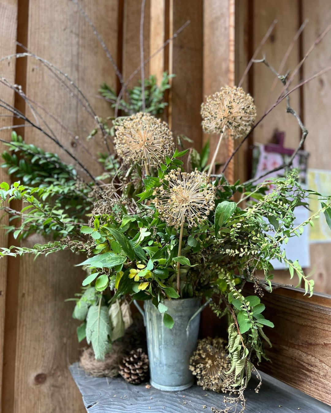 cut arrangement of branches and seed heads