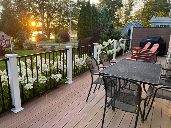 view of garden and lake from raised deck