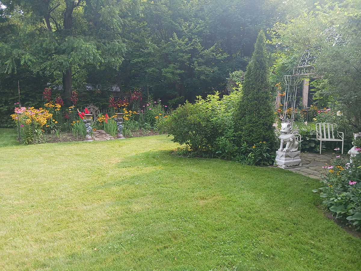 lawn with flower garden in background