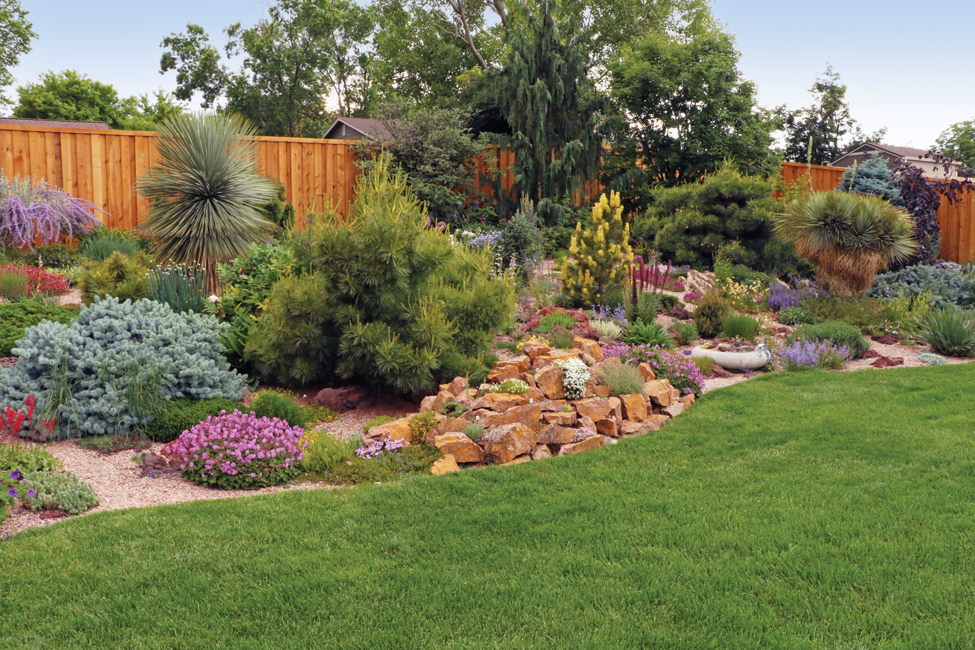 Garden bed planting alongside lawn