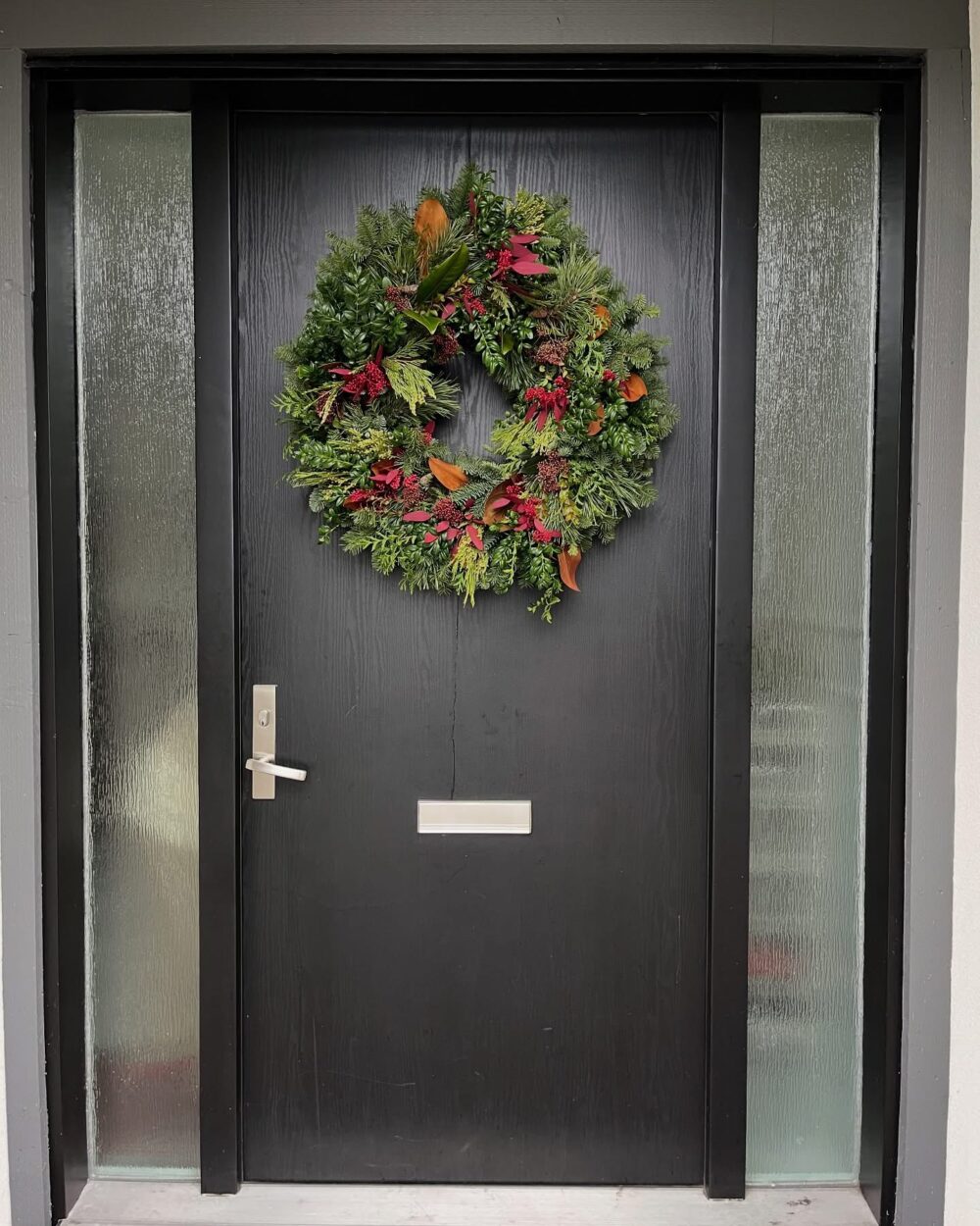 red wreath on door