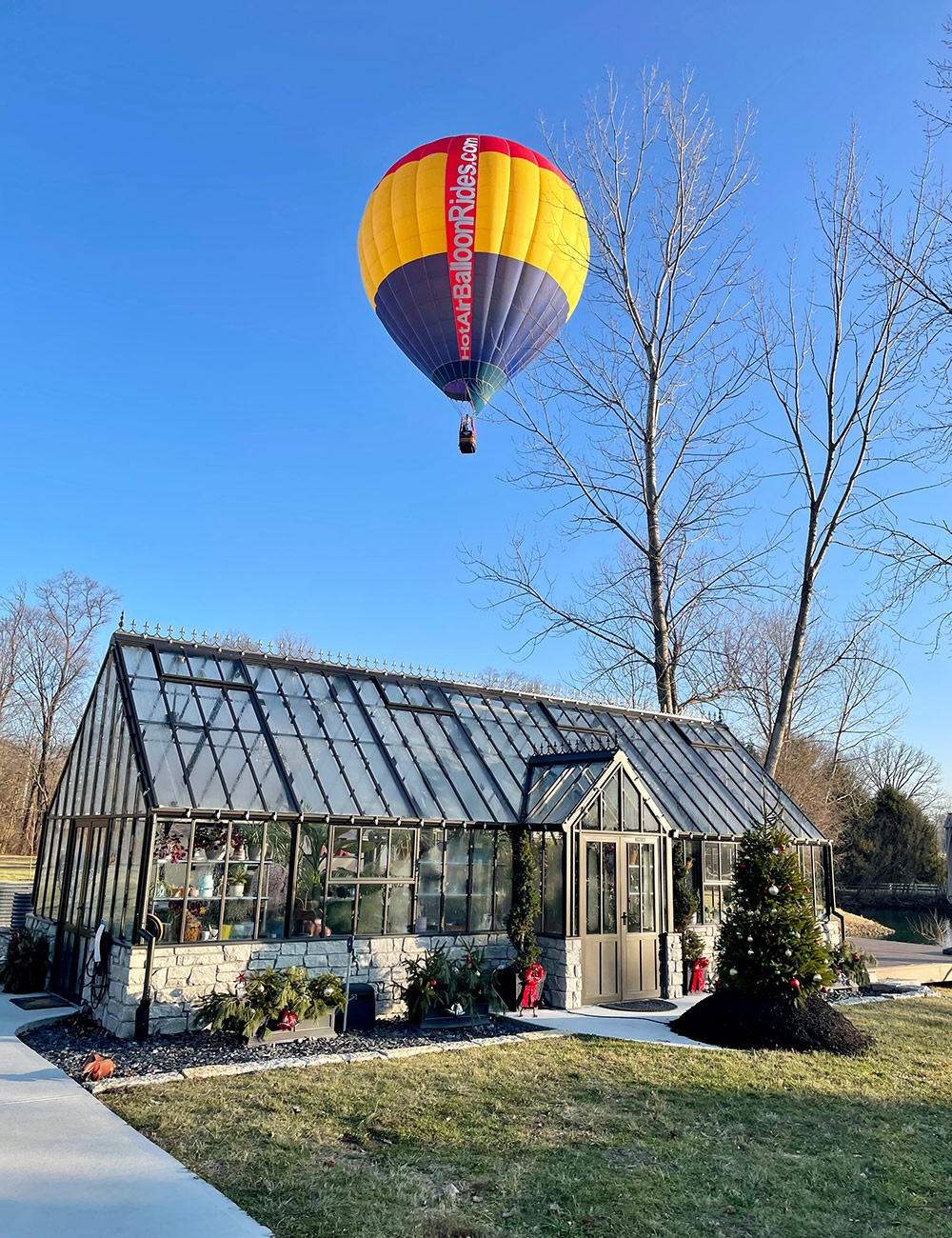 hot air balloon above a greenhouse 