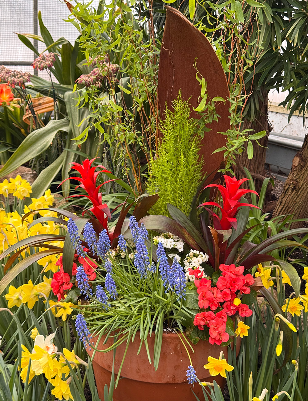 arrangement of spring flowers and tropical plants