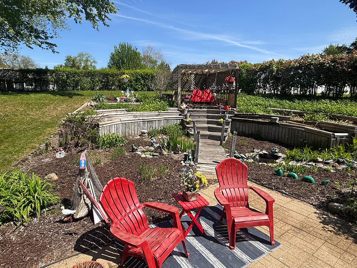 bright red chairs in front of garden